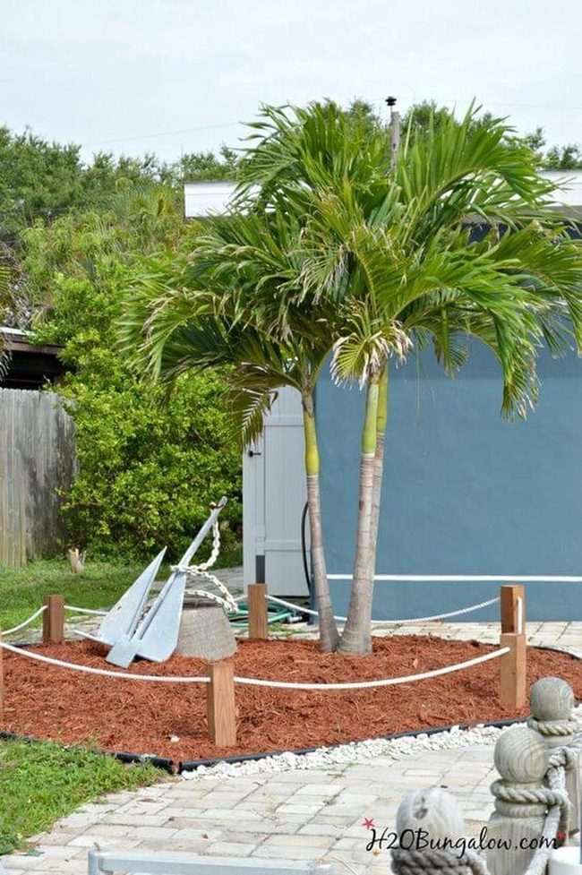 Tropical Garden With White Stone Accents