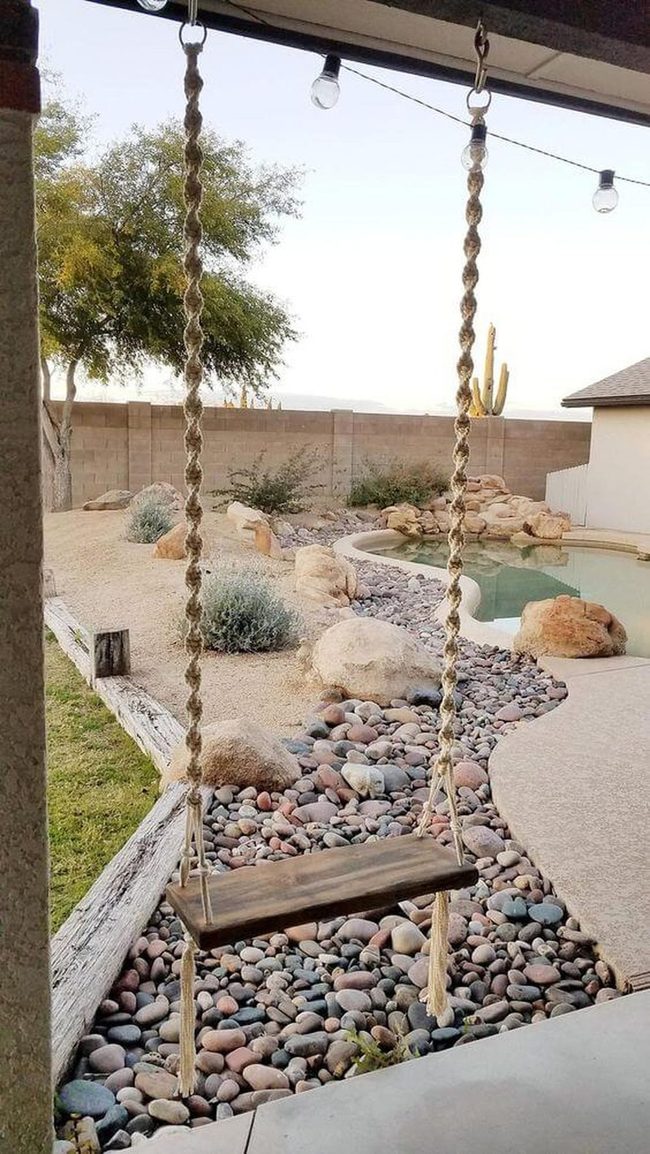 Wooden Swing Above Desert Stones