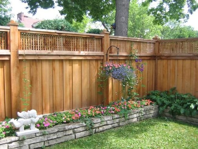 Flowers Spilling From Wooden Garden Walls