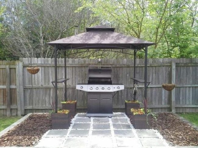 Black Grill Under Metal Canopy