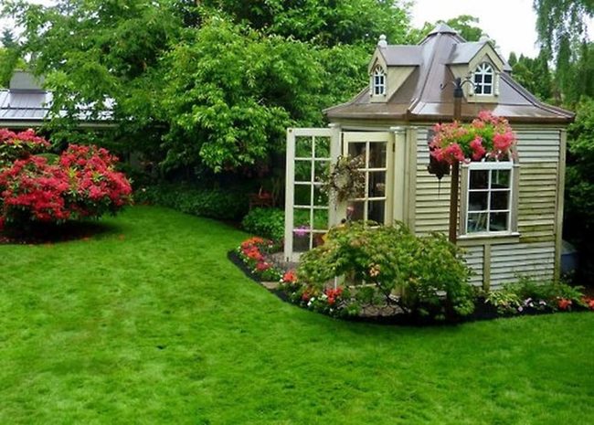 Yellow Cottage With Flowering Gardens