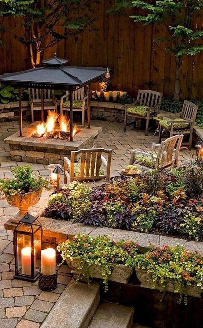 Stone Patio With Firelight And Plants