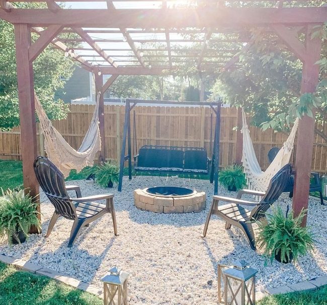 Firelit Gathering Space With Hammocks