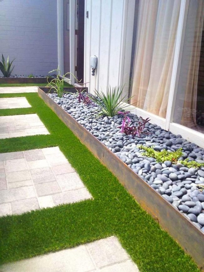 Grey Pebbles Meet Vibrant Green Turf