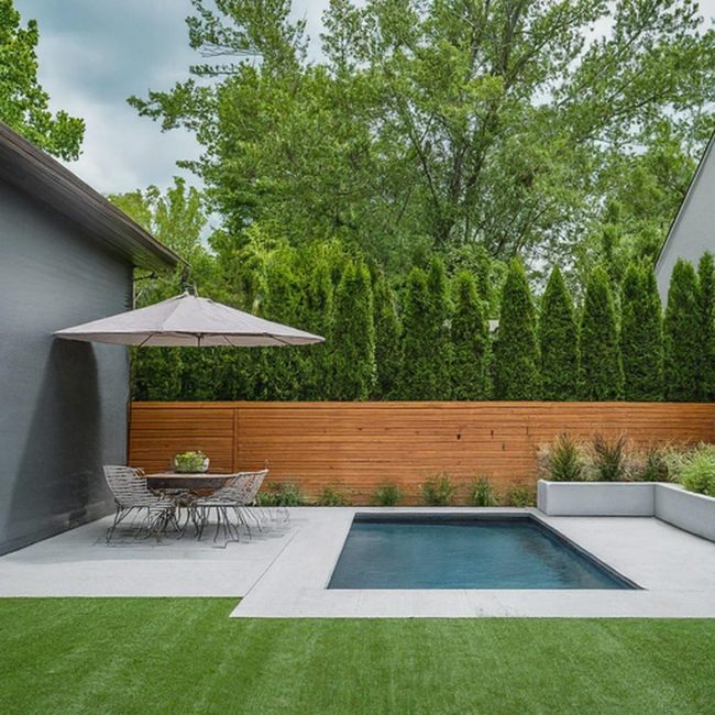 Crystal Blue Pool With Stone Patio