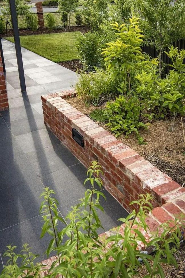 Sunlit Shadows Among Green Brick