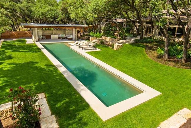 Limestone Pool Nestled In Green Grass