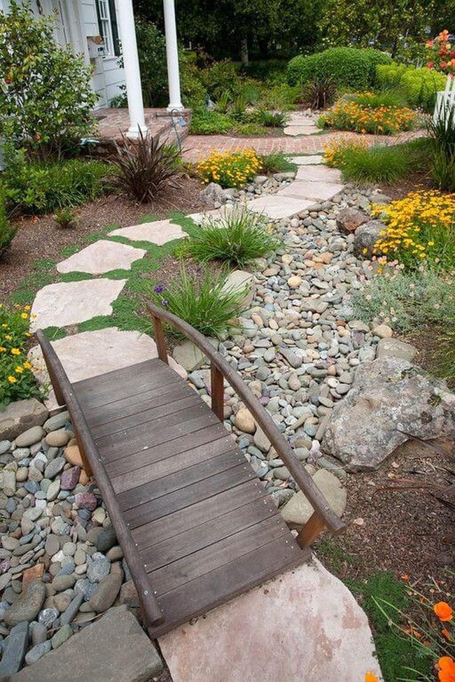 Stone Bridge Through Blooming Garden