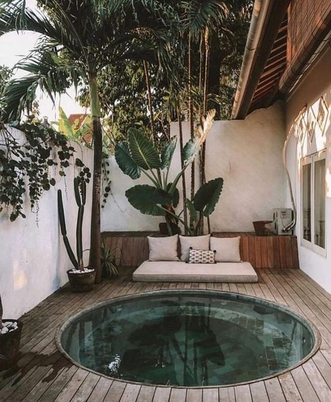 Circular Pool Within Natural Wood Deck