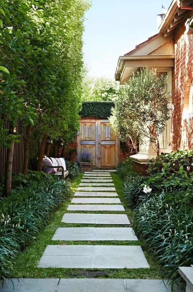 Green Tunnel Toward Red Brick Home