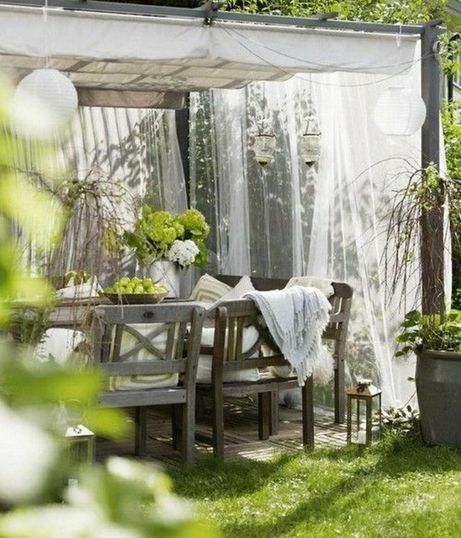 Natural Wood Outdoor Dining With String Lights