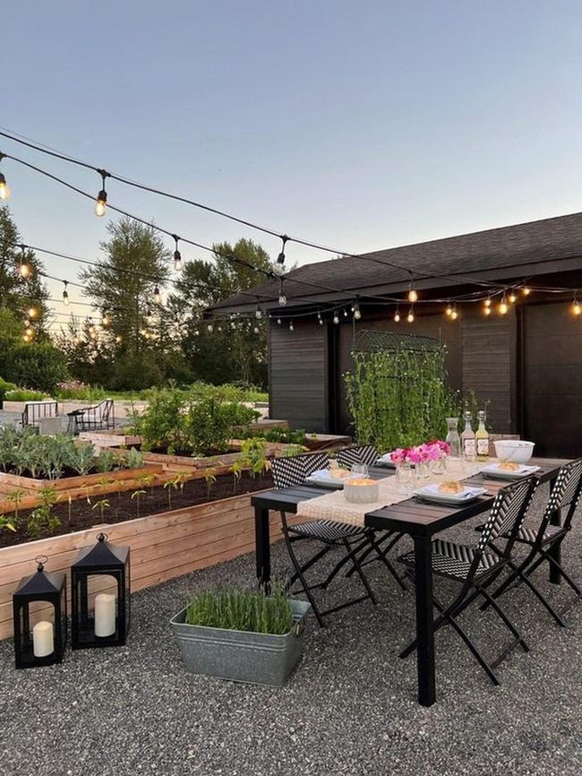 String Lights Over Black Dining Table