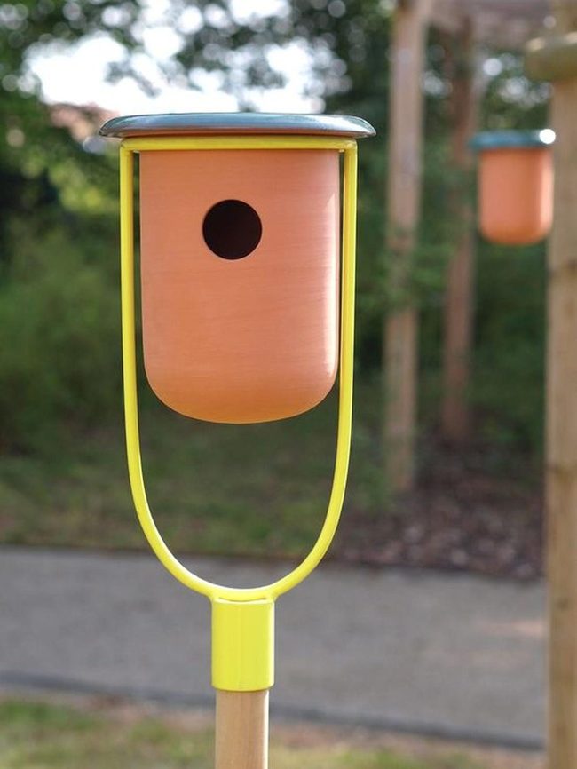 Yellow Birdhouses In Sunlit Garden