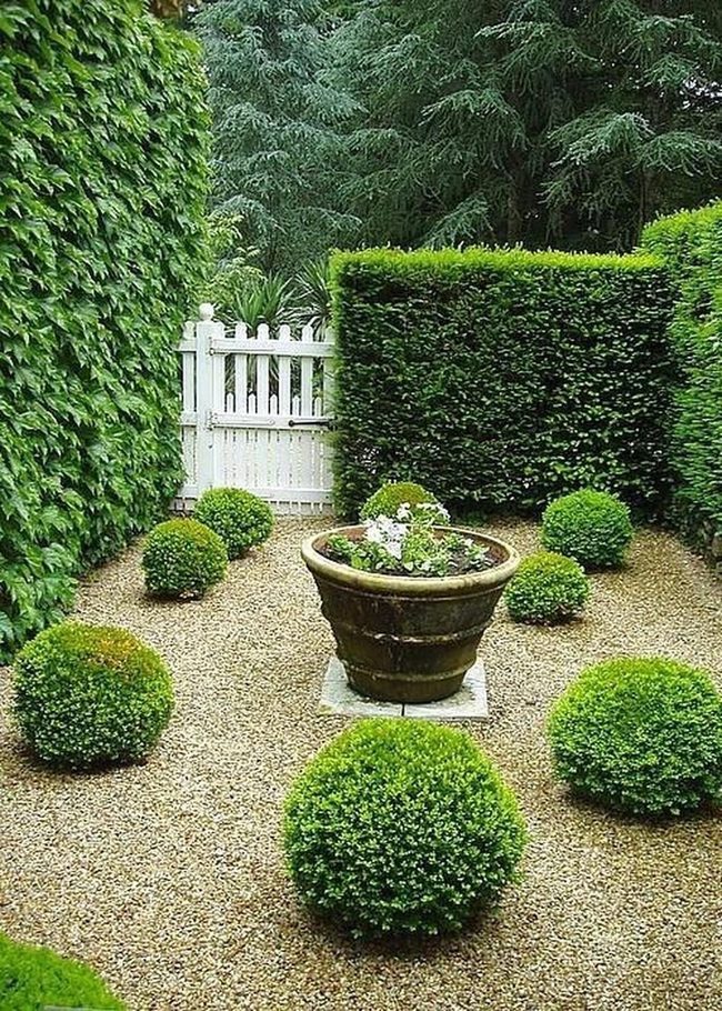 Sculpted Green Spheres And Gravel Pathways