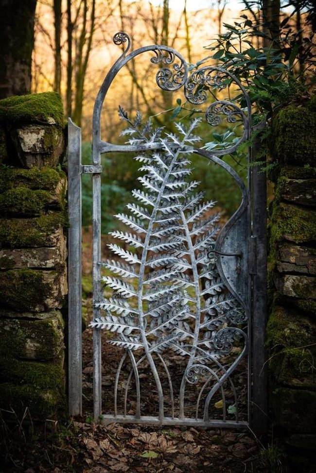 Iron Scrollwork Meets Moss Stone