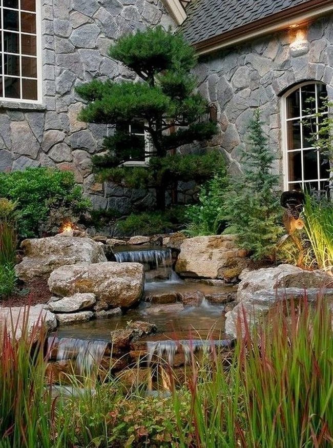 Waterfall Garden With Gray Stone Backdrop