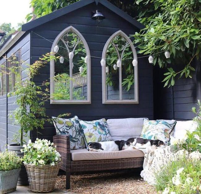 Dark Wood Garden Room With Arched Windows