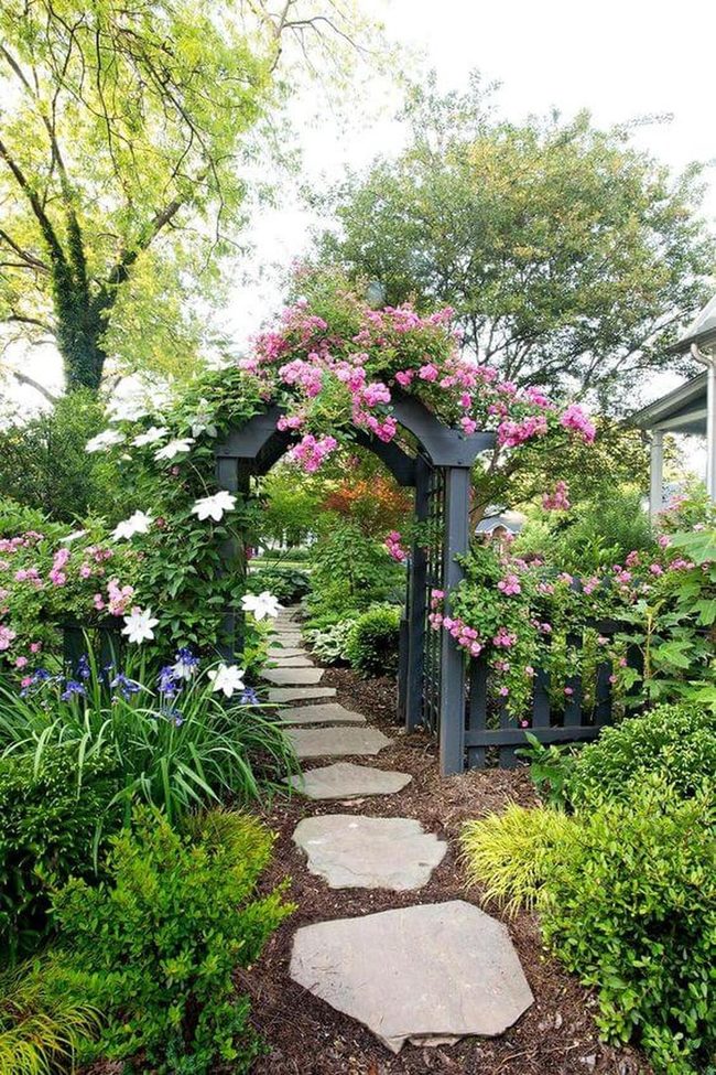 Flower-Draped Arch Into Green