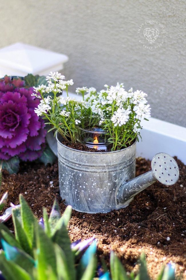 Vintage Watering Can With White Flowers