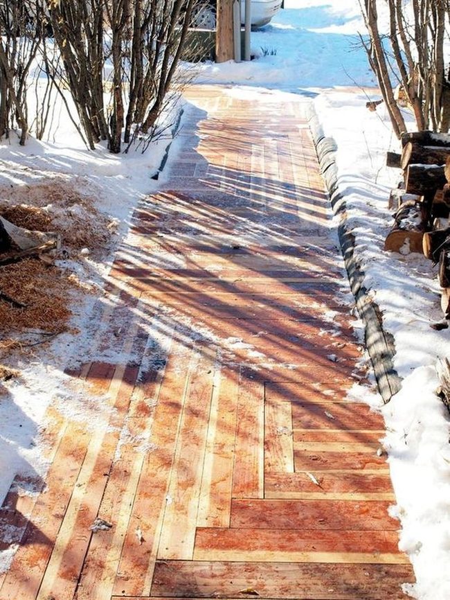 Wooden Path Through Winter Shadows