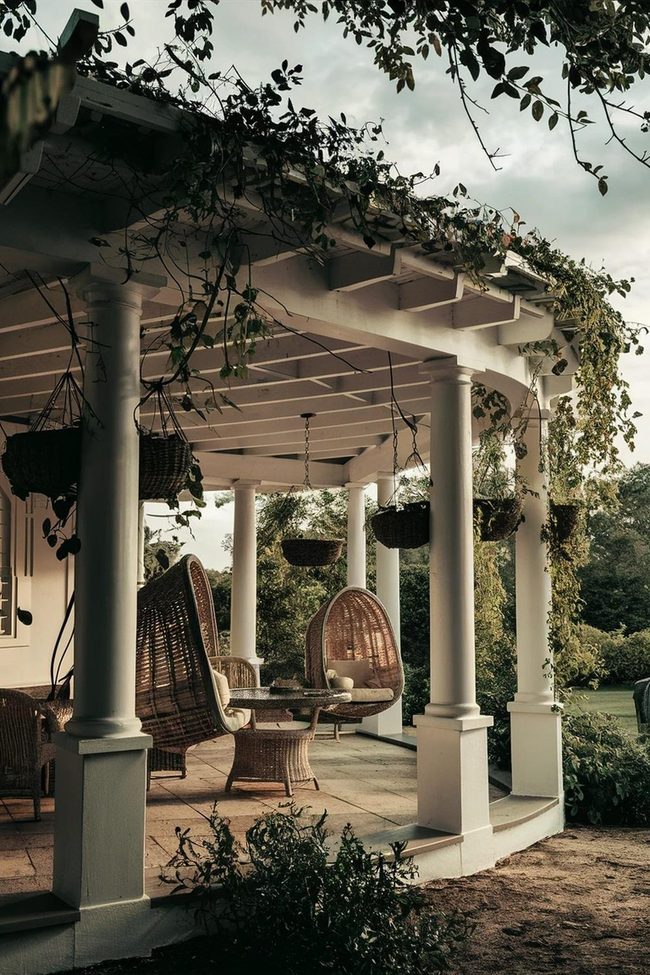 White Pergola Meets Wicker Elegance