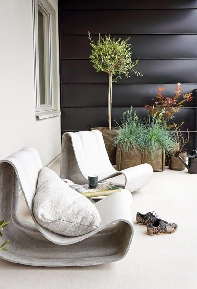 Curved Chairs Against Black Walls