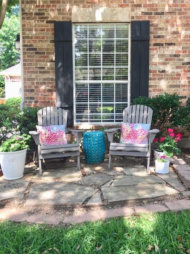 Stone Patio With Leafy Green Borders