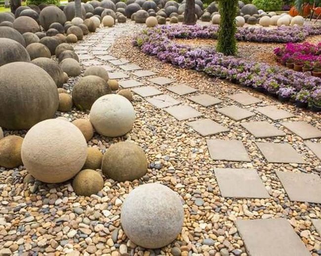Stone Spheres With Flowering Borders