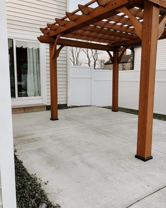 Rich Wood Pergola Over Stone