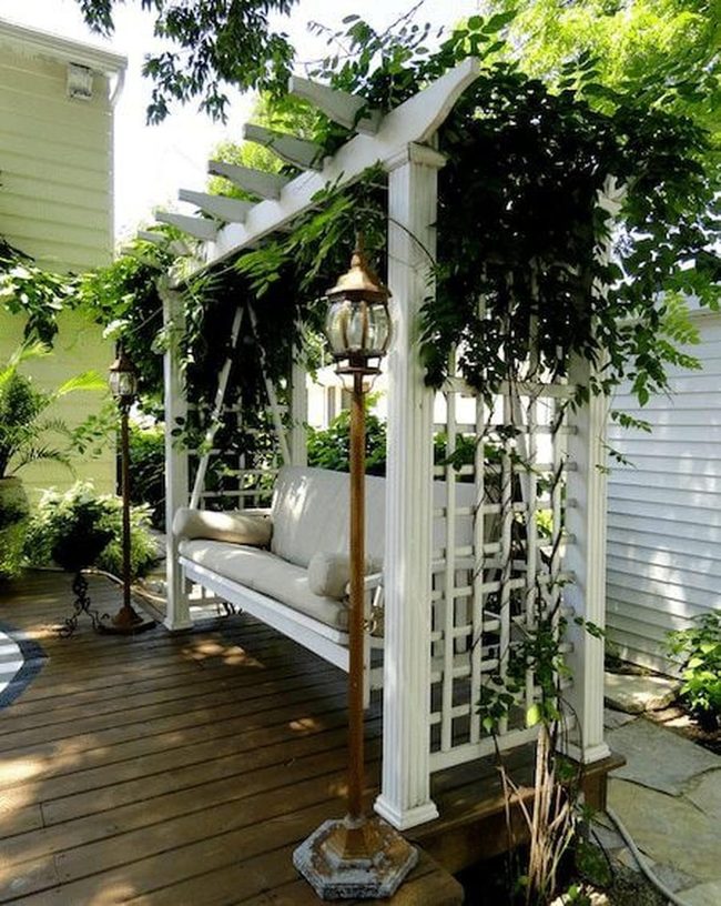 Swinging Garden Retreat With Lantern Light