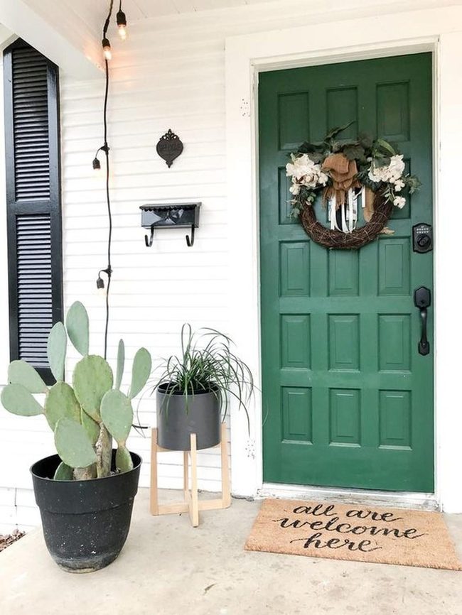 Emerald Door With White Flower Wreath