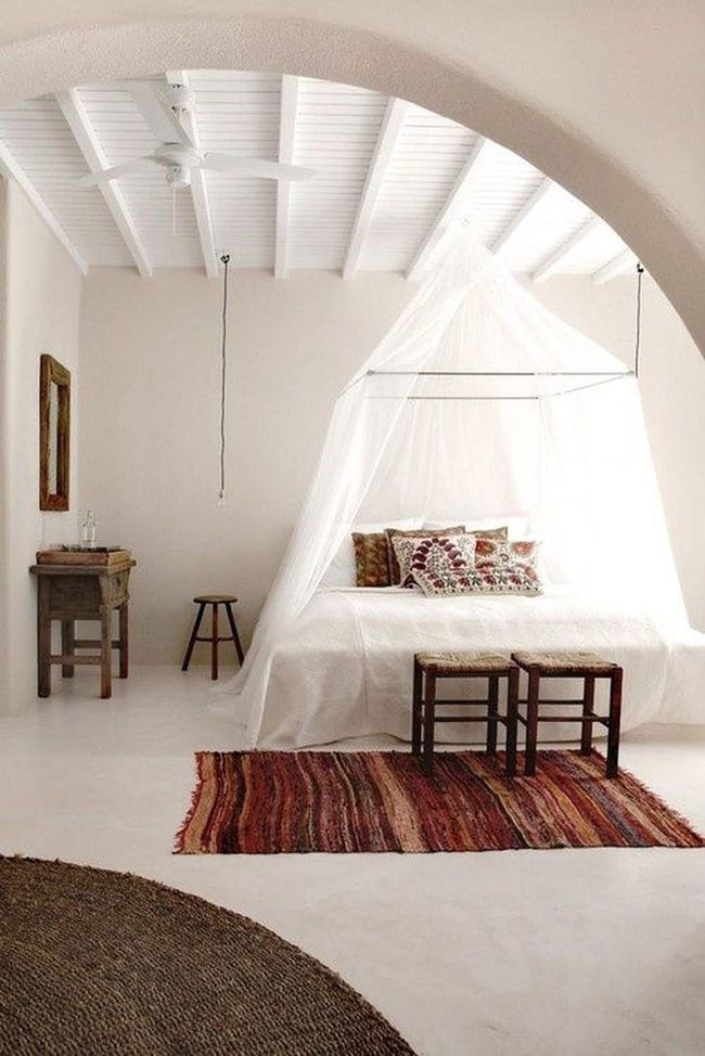 White Canopy Bedroom With Earth Tones