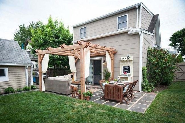 Warm Wood Pergola With Flowing Curtains