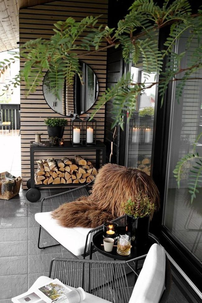 Black Metal Chairs With Firewood Stack