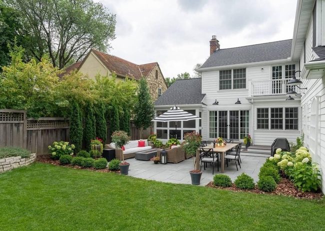 Concrete Patio With Balanced Green Spaces