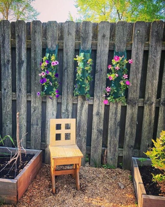 Weathered Wood Planters Against Fences