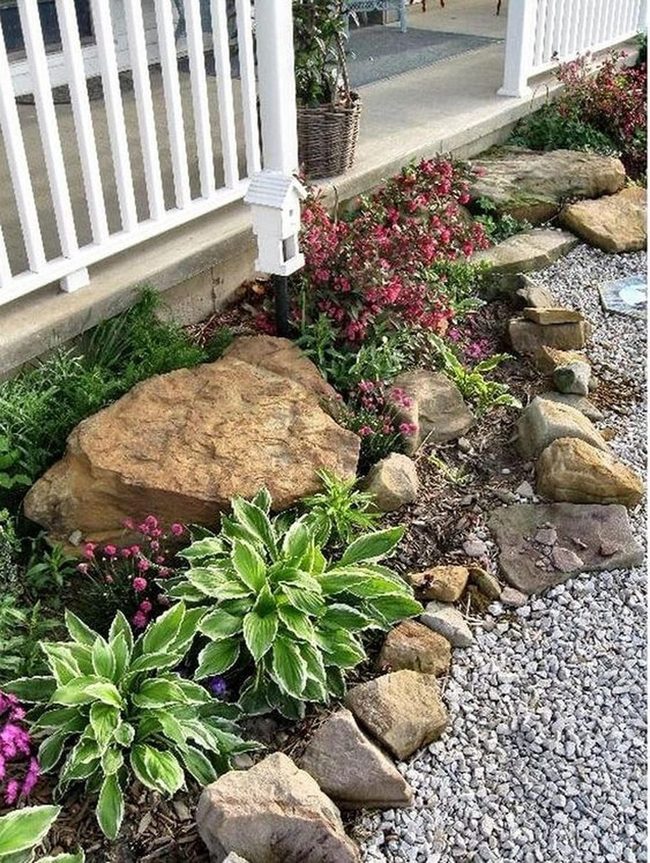 Pink Blooms Against Stone Garden