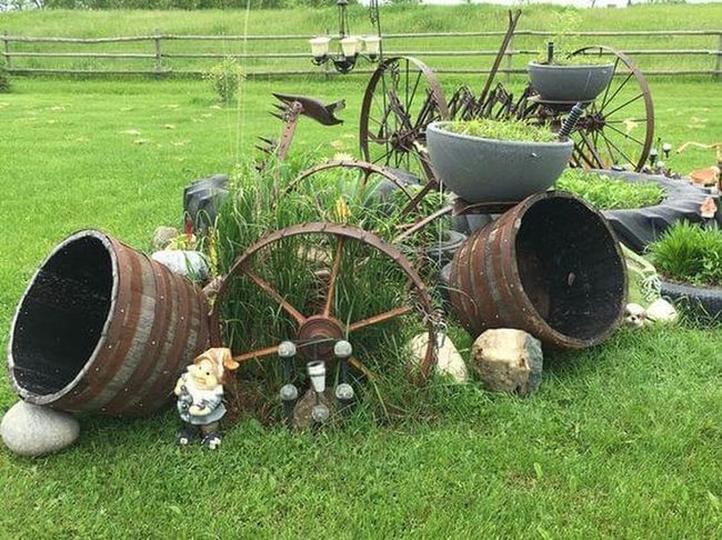 Wooden Barrels Overflow With Garden Character
