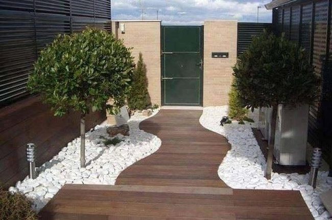Curved Wood Path Through River Rocks