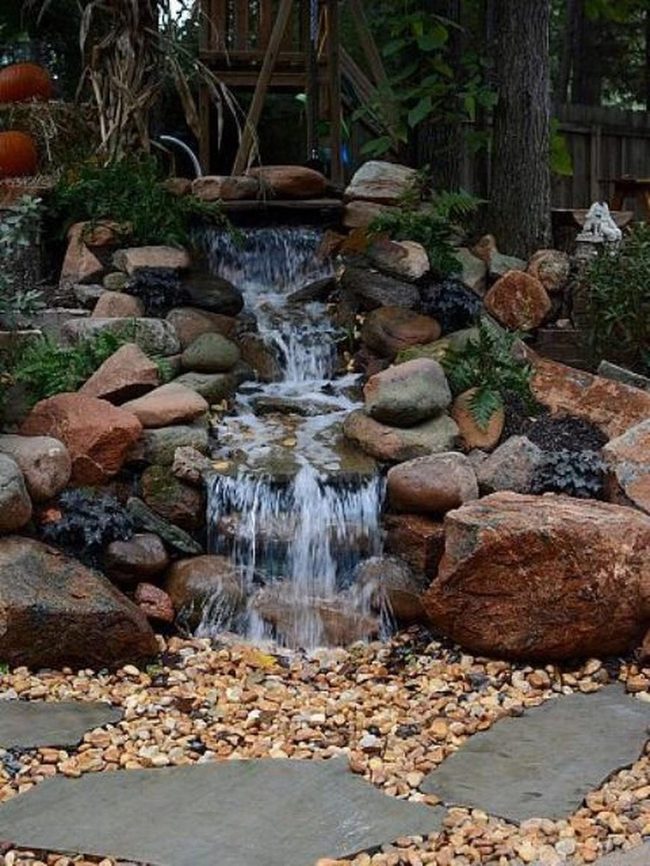 Stone Waterfall Garden With Green Plants