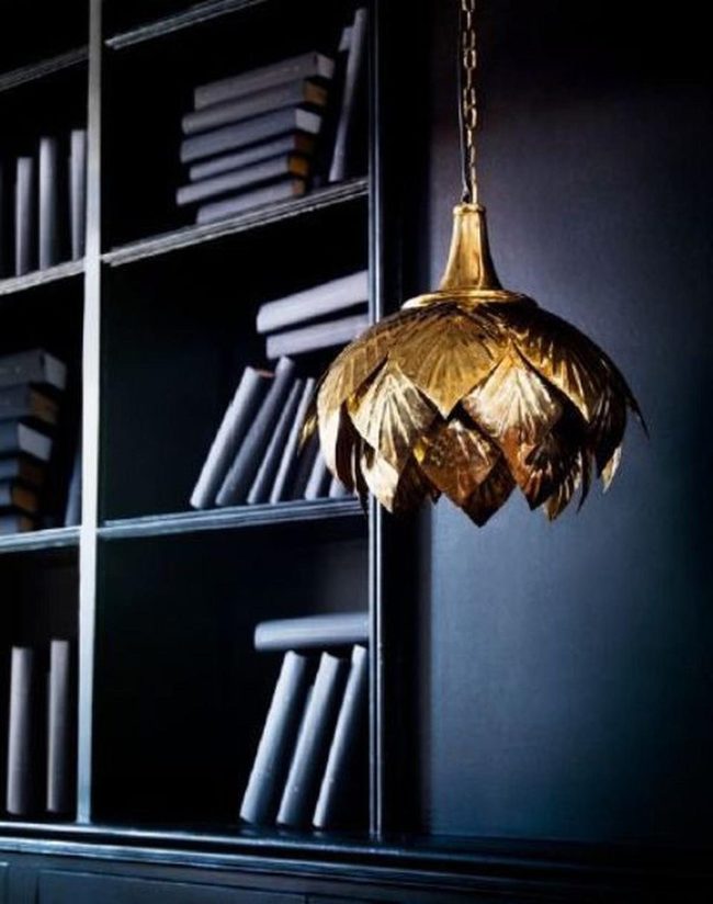 Golden Leaf Light Over Stacked Books