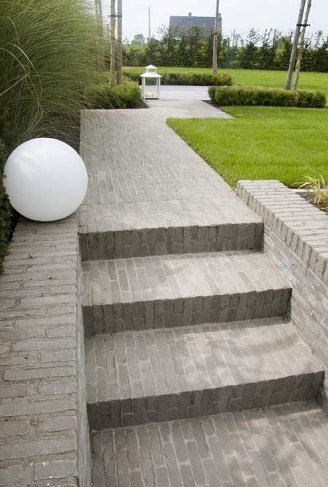 Gray Brick Pathways Through Green Gardens