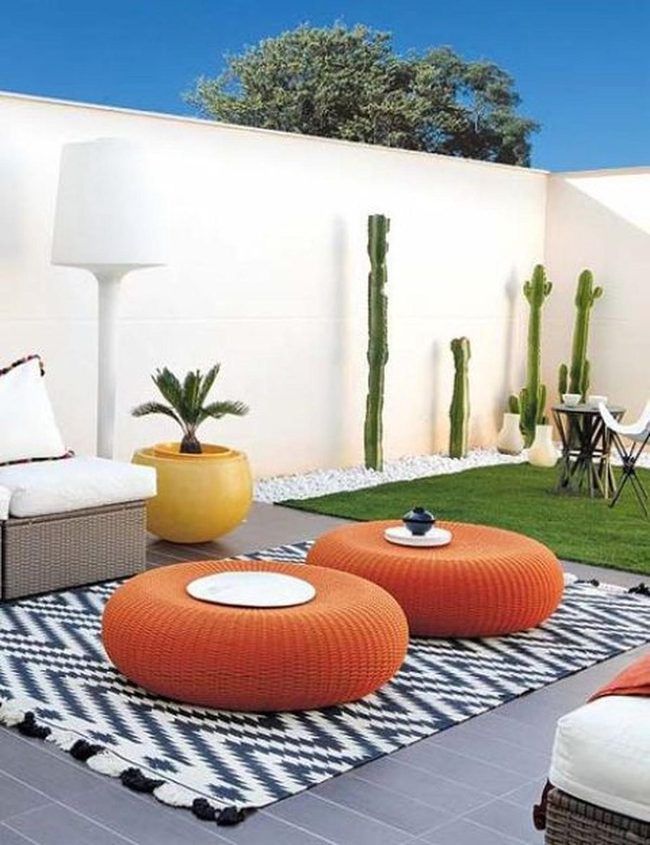 Orange Poufs And Desert Cacti
