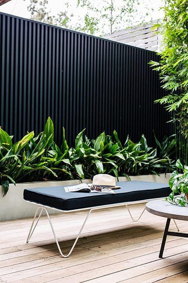 Black Fence Green Plants Wooden Deck