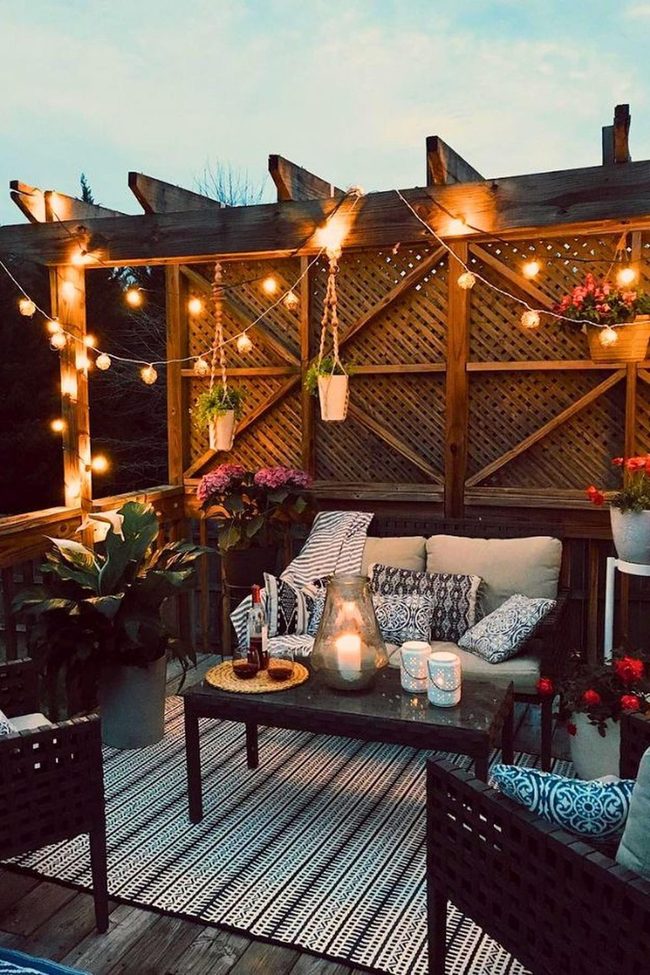 String Lights And Cushioned Outdoor Sanctuary
