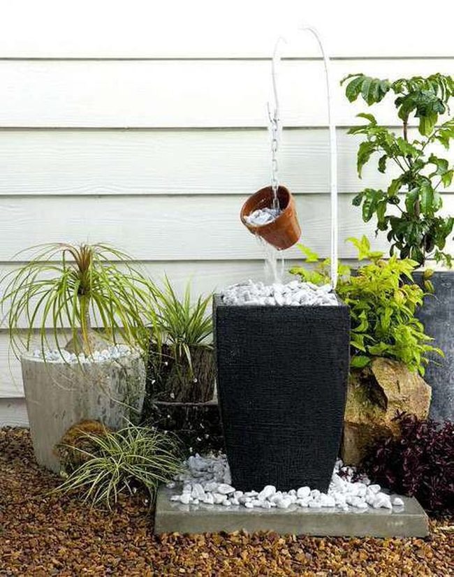 Cascading Water Through Hanging Ceramic Vessels