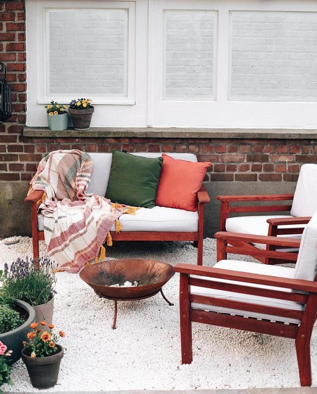 Firelit Wood And Colorful Cushions