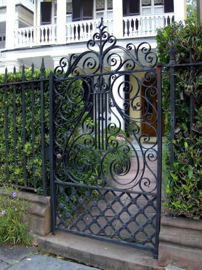Ornate Iron Gates Welcome Stone Pathway
