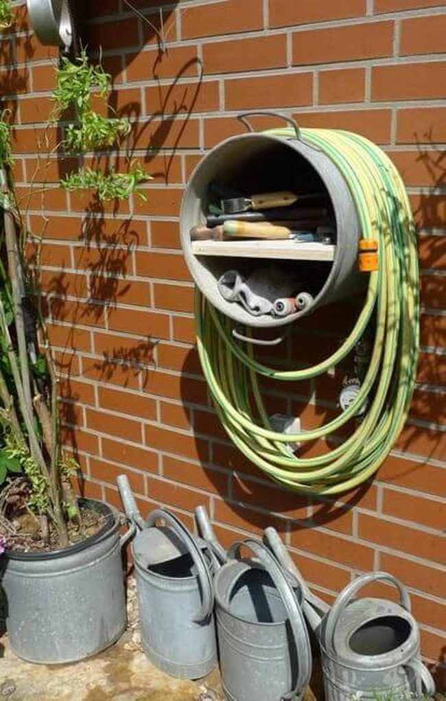 Circular Wall Garden Storage With Coiled Hoses