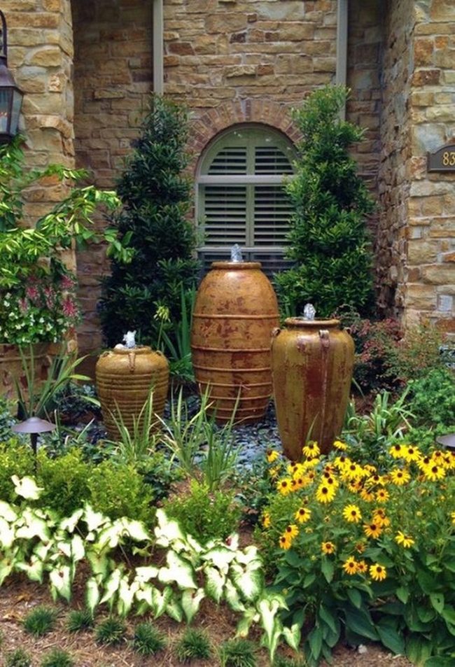 Yellow Flowers Dancing Around Stone Fountains